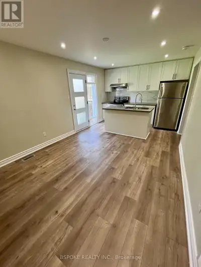 Contemporary 2-bedroom apartment with a rare ground-level entrance and walkout, offering the feel of...