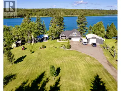Stunning Waterfront Estate offering ultimate multi generational Lakeside Living 200' of Tranquil Sho...