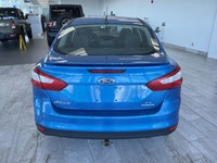 The 2014 Ford Focus SE is a fuel-efficient and compact sedan that's perfect for daily commuting and... (image 3)