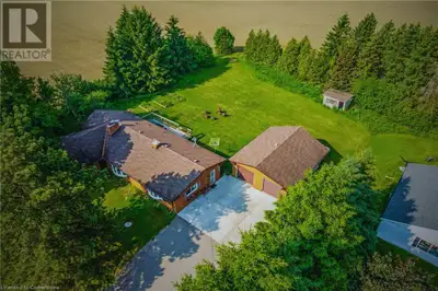 Located on RARE 150x250 ft lot at 858 Trinity Road South in Ancaster, this spacious custom bungalow...