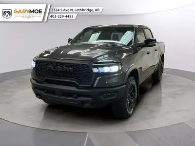 Meet the 2026 Ram 1500 Rebel 4x4 Crew Cab 57 Box: a commanding presence in a refined gray shade. Bui...