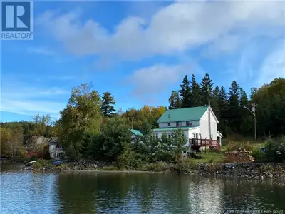 MLS® #NB100796 ONE AND A HALF FLOOR STYLE PROPERTY WITH LARGE EXTENSION FACING THE LAKE (SUNROOM). T...