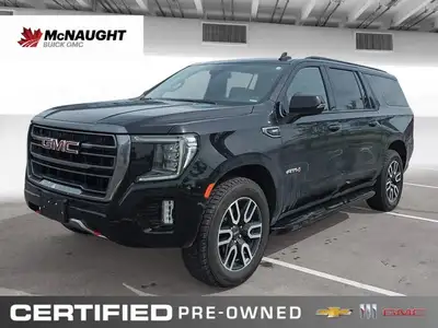 Experience the premium capability and rugged refinement of the 2023 GMC Yukon XL AT4. This used full...