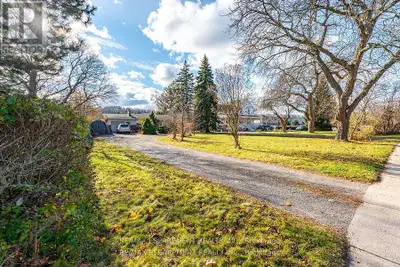 This charming 2-bedroom bungalow, set on just under half an acre of mature, beautifully landscaped g...