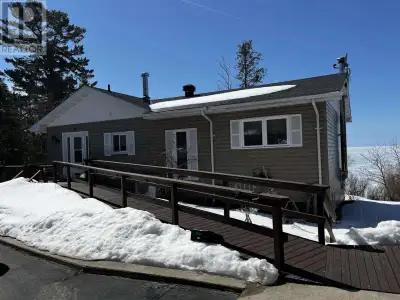 Live on Lake Superior while earning income! This meticulously maintained waterfront home offers over...