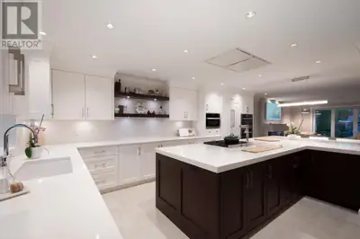 Magnificent, luxuriously renovated residence offering quality finishes, total privacy & smart home t...