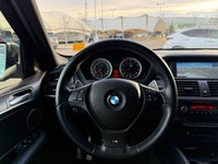 This 2011 BMW X5 M takes BMWs flagship SUV and infuses it with true M-division performance, deliveri... (image 6)