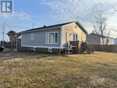 Charming bungalow on a large corner lot with a view of beautiful Hall's Bay. Main floor features a b...