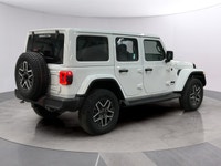 Experience the rugged charm of the new 2026 Jeep Wrangler Sahara 4 Door 4x4 in a striking white fini... (image 4)