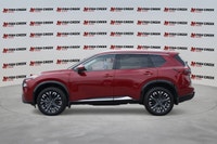 The 2025 Nissan Rogue Platinum, in striking Red, offers a sophisticated driving experience with only... (image 1)