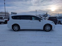 The 2026 Chrysler Grand Caravan SXT in Bright White with a Black interior offers a perfect balance o... (image 7)