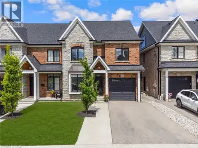 Offering over 3,500 square feet of impeccably finished, carpet-free living space, this exceptional r...