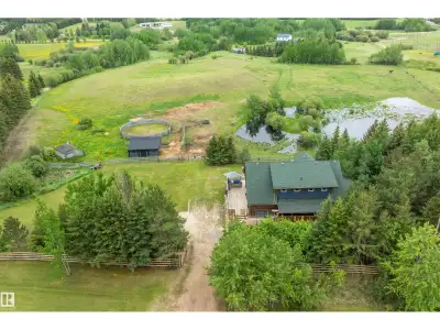 AMAZING UPDATED & UPGRADED, 2058 sq. ft. WALK OUT 2 STOREY LOG HOME on 6.94 GORGEOUS ROLLING & TREED...