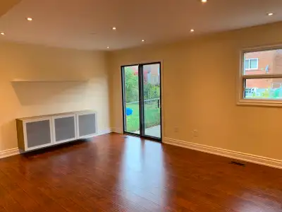 Beautiful , Bright, Spacious, Renovated 3 Bedrooms Apartment in the ground level and basement of a h...