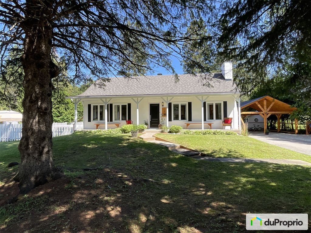 $695,000 - Bungalow for sale in Mont-Tremblant (St-Jovite) — photo 1