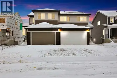 Welcome home to this stunning walkout duplex that perfectly blends modern elegance with functional d...