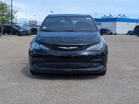 The 2026 Chrysler Grand Caravan SXT in Diamond Black Crystal Pearl with a Black interior offers a bl... (image 8)