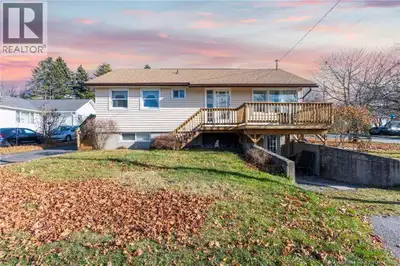 Welcome HOME! Move-in ready bungalow with a full walk-out basement situated on a landscaped corner l...