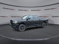 Meet the 2023 RAM 2500 Big Horn 4x4 Crew Cab 6'4 Box with the Night Edition package, offered by Hald... (image 3)