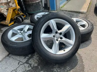 Nice clean set of orginal Audi Q5 wheels mounted on Nokian summer tires. NOTE: Tires are good for 1...