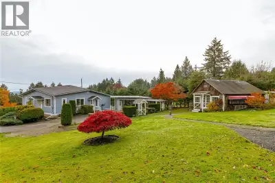 Nestled in the unbeatable location of Mill Bay on a private .62 acre parcel surrounded by mature hed...