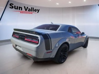 The 2022 Dodge Challenger Scat Pack boasts a roaring 392 Hemi engine paired with a manual transmissi... (image 3)