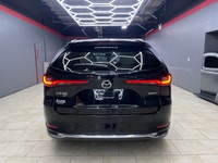 The 2024 Mazda CX-90 PHEV GT in a stunning black finish offers the perfect blend of luxurious style... (image 4)