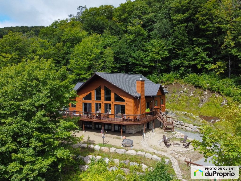 $899,000 - Cottage for sale in Val-Des-Lacs — photo 1