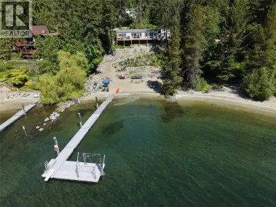 Rare opportunity to own 100 feet of stunning sandy waterfront on Kootenay Lake in the highly sought-...