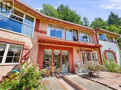 Beautifully built post and beam home with corridor water views, across the street from Lions Bay Mar...
