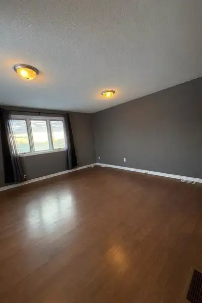 Bright 1414 ft furnished bedroom with closet, modern flooring, and plenty of natural light in a very...