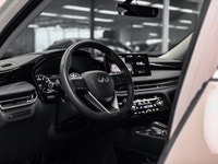 Elevate your driving experience in the sophisticated 2025 INFINITI QX60 Pure, finished in striking G... (image 9)