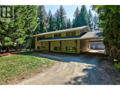 Welcome to 4072 Butter Rd in Scotch Creek, just steps from Shuswap Lake! This cathedral-entry home s...