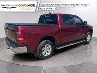 Experience the bold presence of the 2023 Ram 1500 Laramie in stunning red with the unstoppable 44 dr... (image 2)