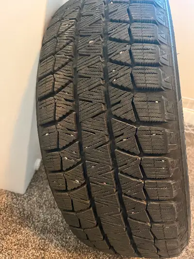 BLIZZAK used WINTER TIRES off rims. 215/55/R17. Used for 1 winter only. Excellent condition.