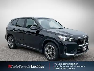 The 2025 BMW X1 xDrive28i arrives as a striking black Sport Utility vehicle, seamlessly blending ath...