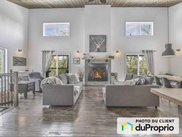 $565,000 - Cottage for sale in Mandeville — photo 1