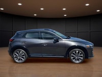 Get ready to conquer the roads with the 2022 Mazda CX-3 GT, a sophisticated gray SUV that combines a... (image 4)