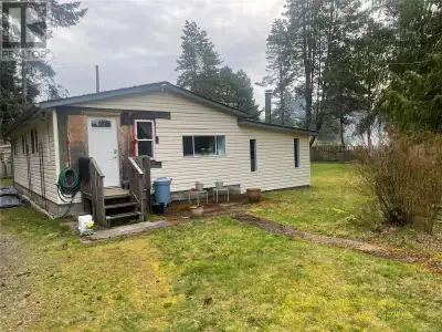 Opportunity Knocks in Qualicum Beach! Set on over half an acre of level, useable land, this unique r...