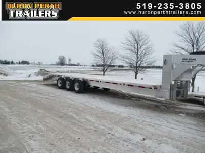 Gooseneck 32' flat deck length includes 2' beaver tail 3-10,000lb Dexter tor flex axles Spare tire F...