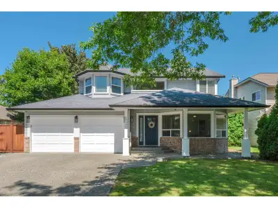 Beautiful 2-storey home on a quiet, tree-lined street in upper Murrayville. Main floor boasts wide p...