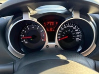 This 2012 Nissan Juke (JAPANESE)is a reliable SUV with a stylish white exterior and a sleek black in... (image 7)