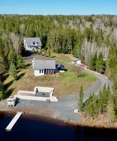 Escape to tranquility with this charming lakefront residence/cottage nestled on a 1.47 acre private...