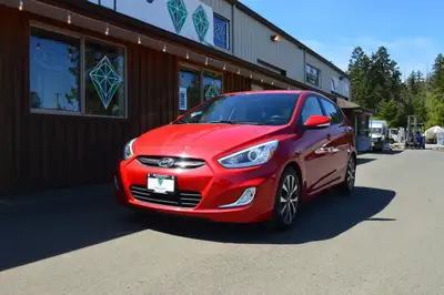 WOW!! LOW KMS!! BC Only, No Accidents 5-door Hatchback! Tick every box with this ravishing red 2015...