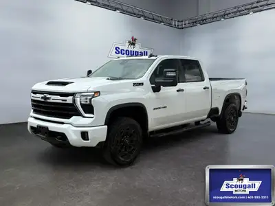 Introducing the stunning 2024 Chevrolet Silverado 3500HD LT in pristine white with a robust 44 drive...