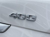 The 2026 Cadillac XT5 Sport AWD, finished in Crystal White Tricoat with a rich Kona Brown interior w... (image 6)