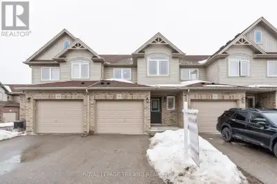 Welcome to Unit 50, 1220 Riverbend Road, an exquisite modern townhouse condominium in Warbler Woods...
