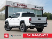 The 2019 Toyota Tacoma TRD Off Road 4x4 Double Cab V6 in a stunning white color with a robust 4x4 dr... (image 4)