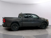 The 2026 Ram 1500 Sport, presented in a sophisticated gray finish, offers powerful 44 capabilities c... (image 5)