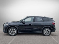 The 2025 BMW X1 xDrive28i arrives as a striking black Sport Utility vehicle, seamlessly blending ath... (image 7)